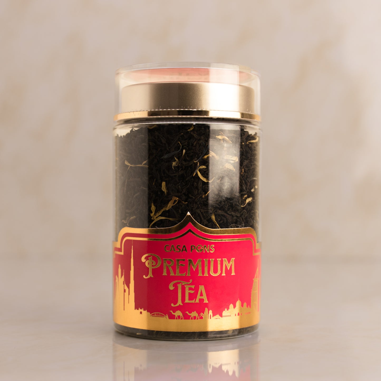 Jar of Casa Pons Premium Tea with a red and gold label on a beige background