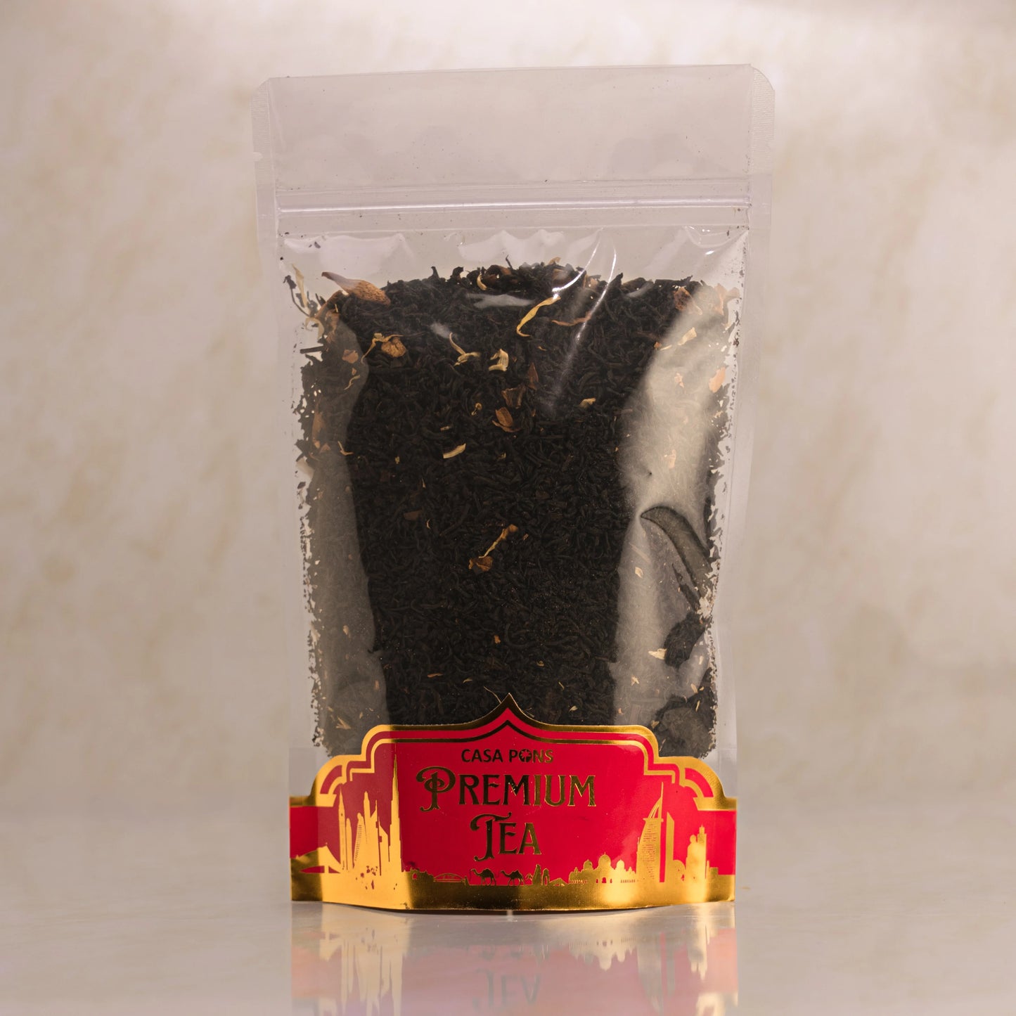 Clear packaging of Casa Padrón premium tea with a red label on a light gray background