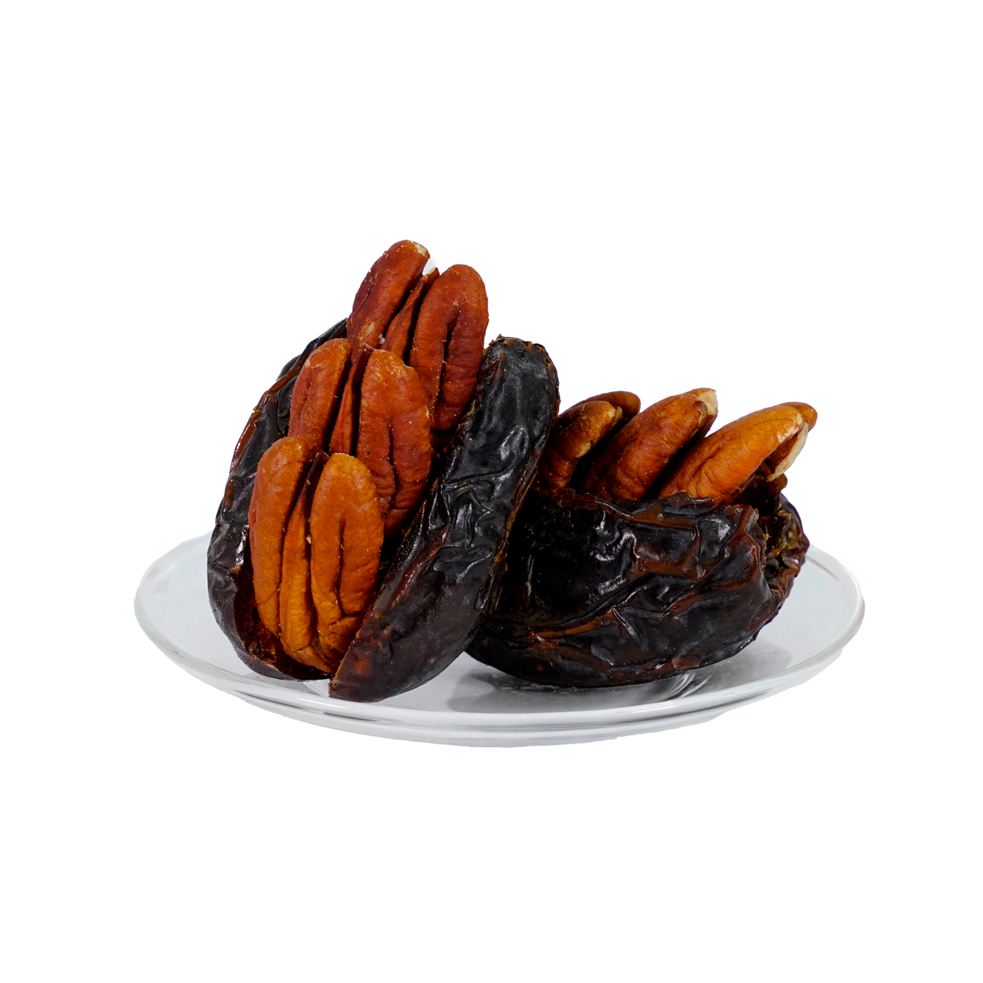 A plate with several dates stuffed with pecans against a white background.