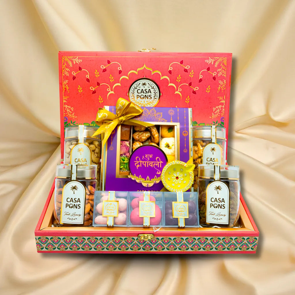 Fushia Elephant Medium Rectangle Basket Diwali gift with pecans, malban, marzipan, raw nuts, raisins, chocolate freeze-dried fruits, and diya in handcrafted box.