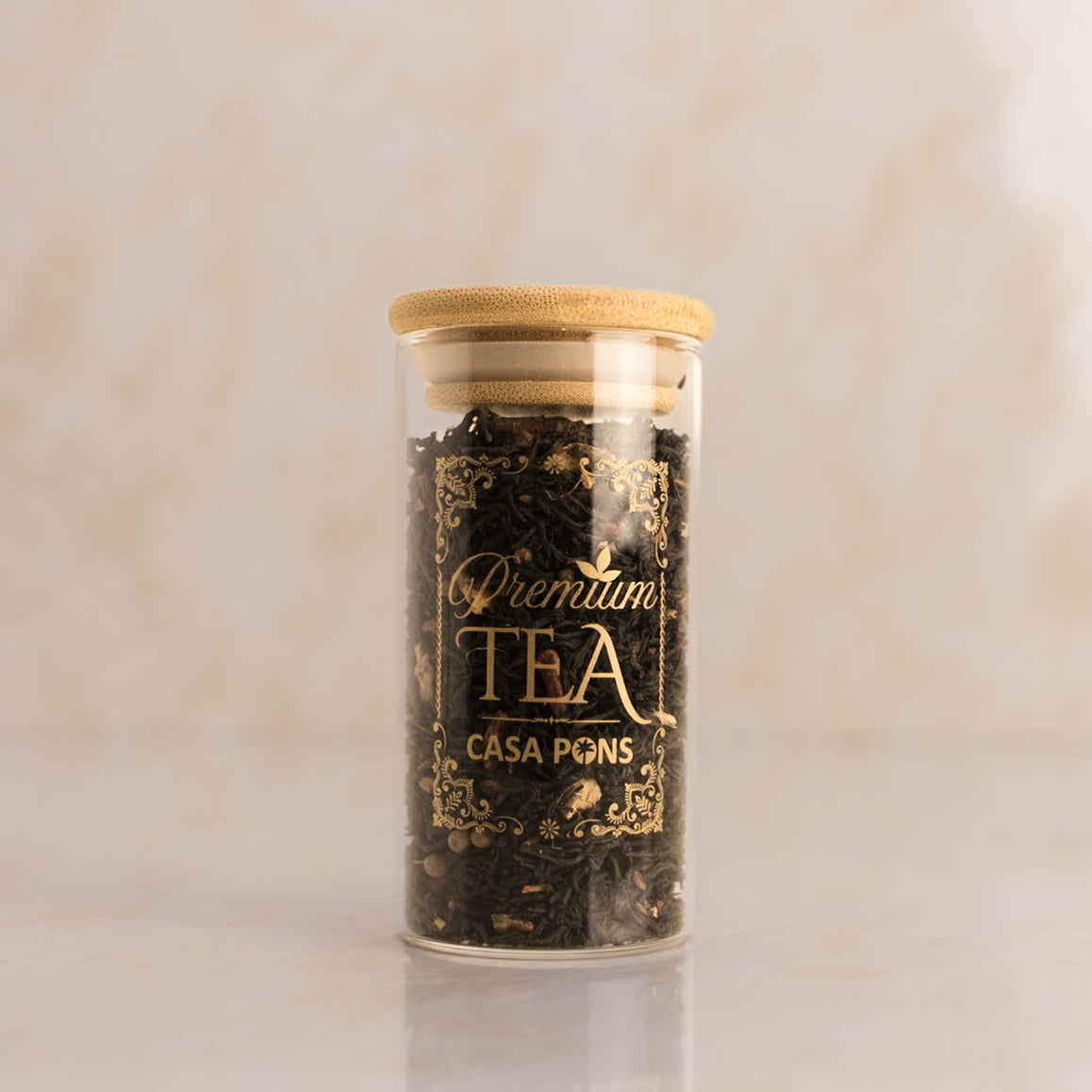 Jar of Casa Pons tea with a wooden lid on a beige background