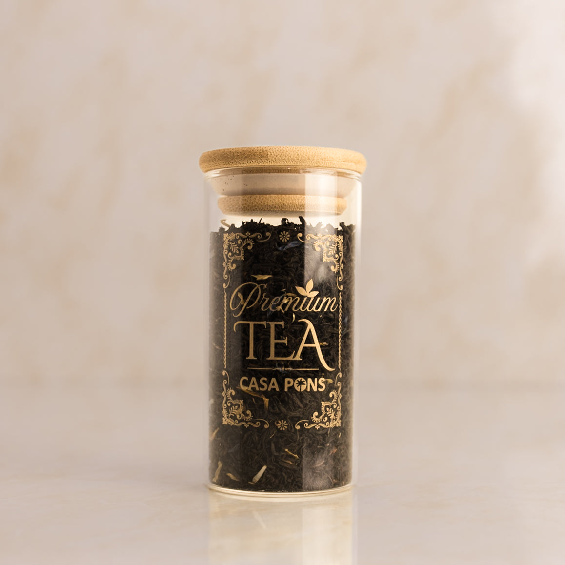 Tea jar with wooden lid and 'Casa Pons' branding on a beige background