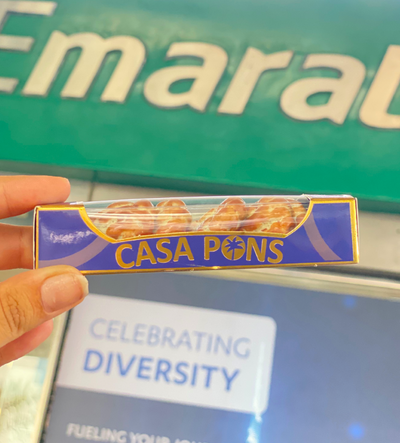 Casa Pons snack bar held over a 'Celebrating Diversity' sign with Emaral background