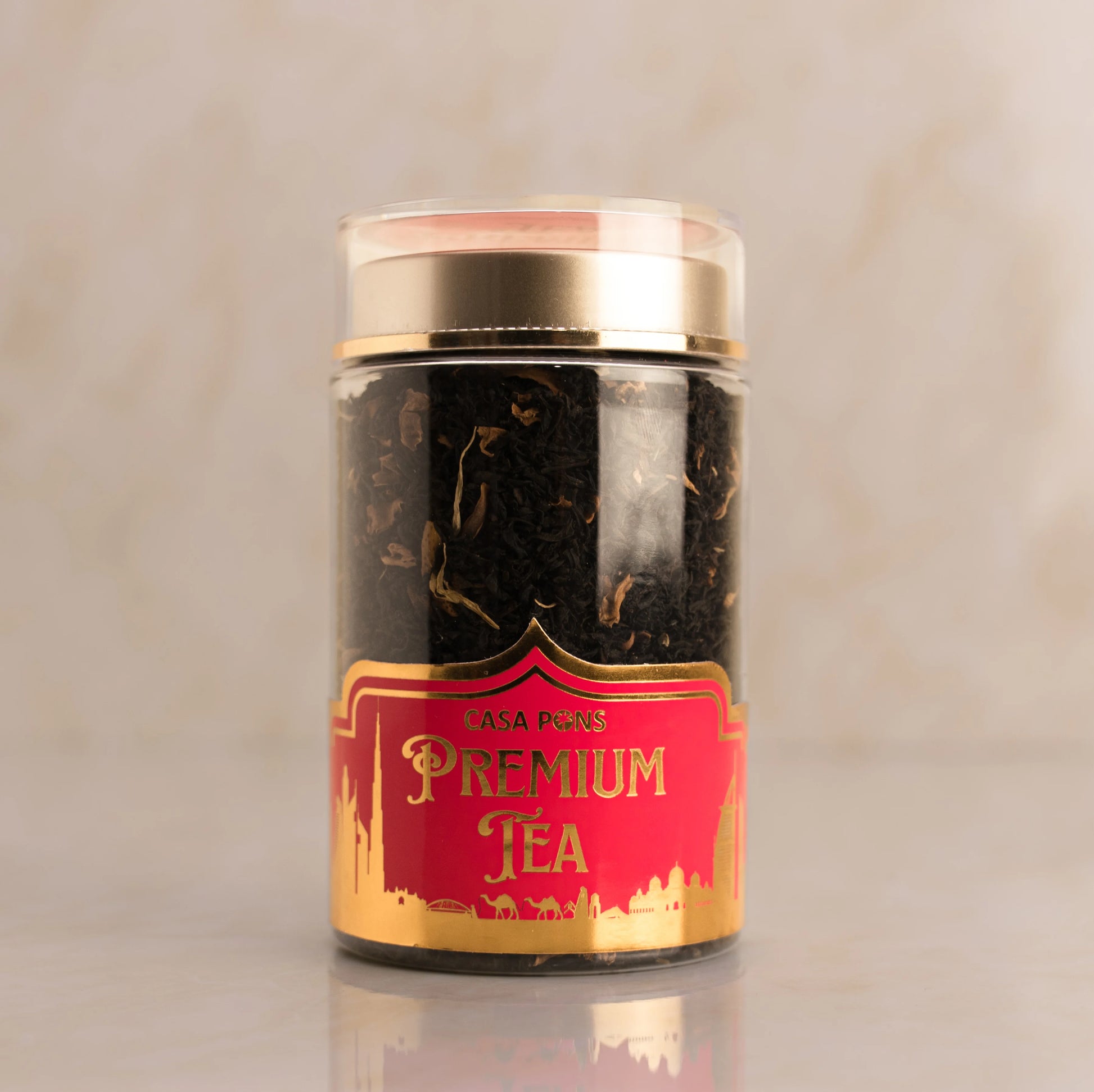 Jar of Casa Pecos Premium Tea with a red label on a beige background