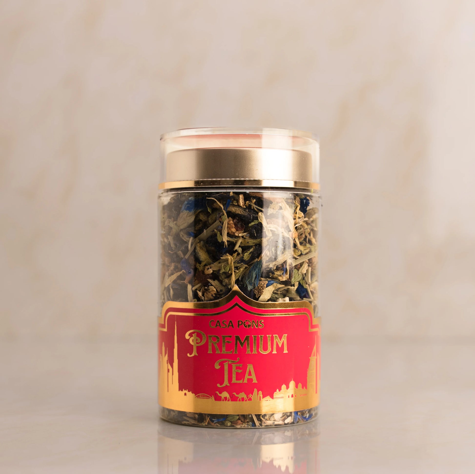 Jar of premium tea with a red label on a beige background