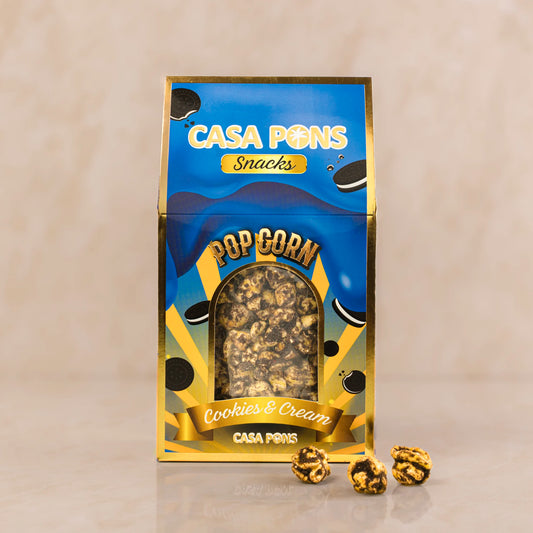 Casa Pons snacks packaging for cookies & cream popcorn on a beige background