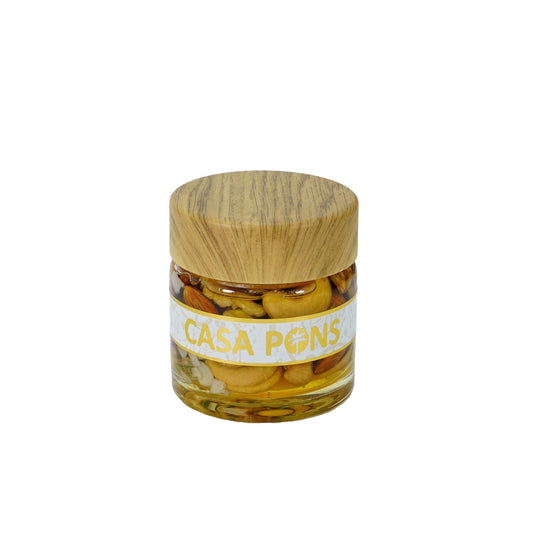 Jar of Casa Pons olives with a wooden lid on a white background