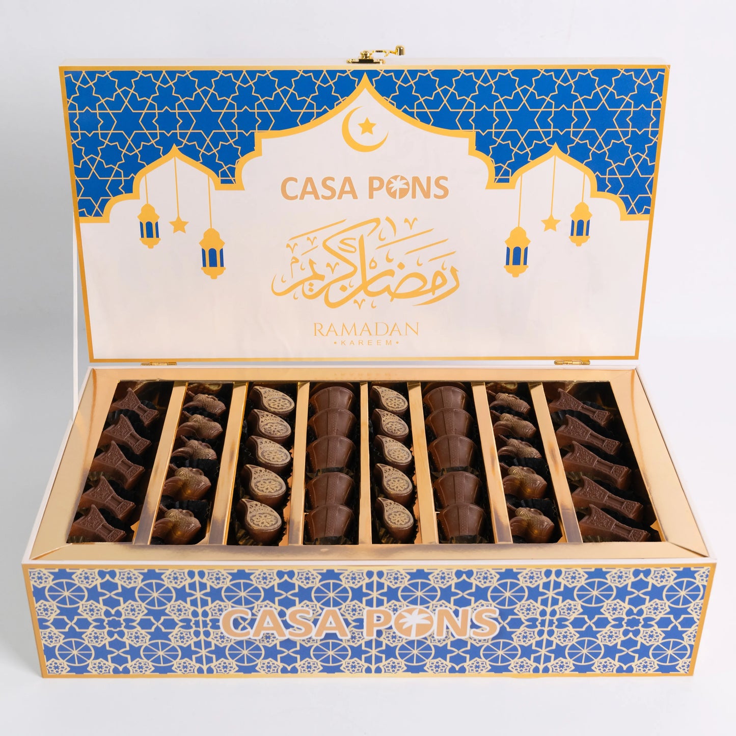 Open box of Casa Pons Ramadan chocolates with blue and gold design.