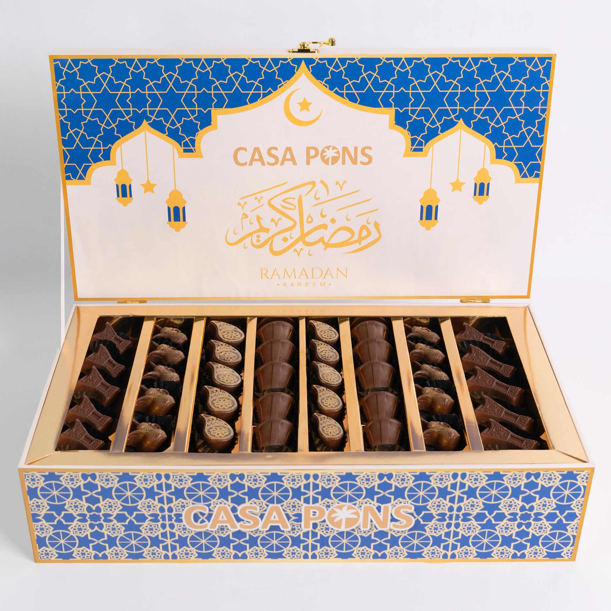 Open box of Casa Pons Ramadan chocolates with blue and gold design.