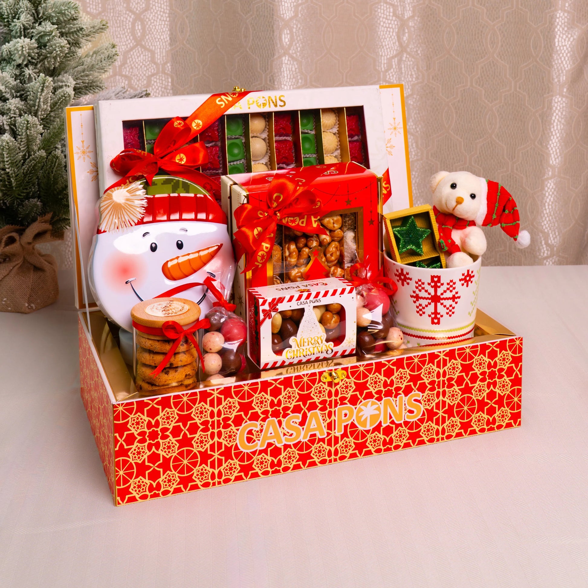 Casa Pons gift set with Christmas-themed items on a decorative surface.