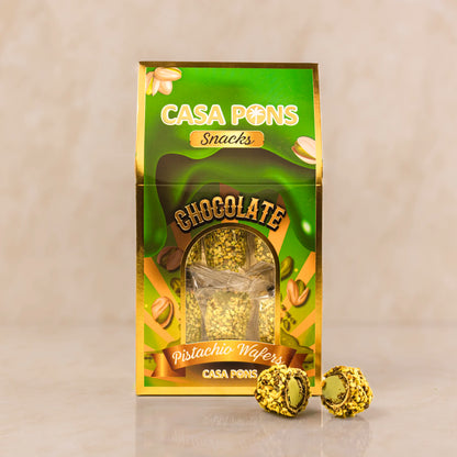 Casa Pons chocolate pistachio wafers packaging with two wafers on a beige background