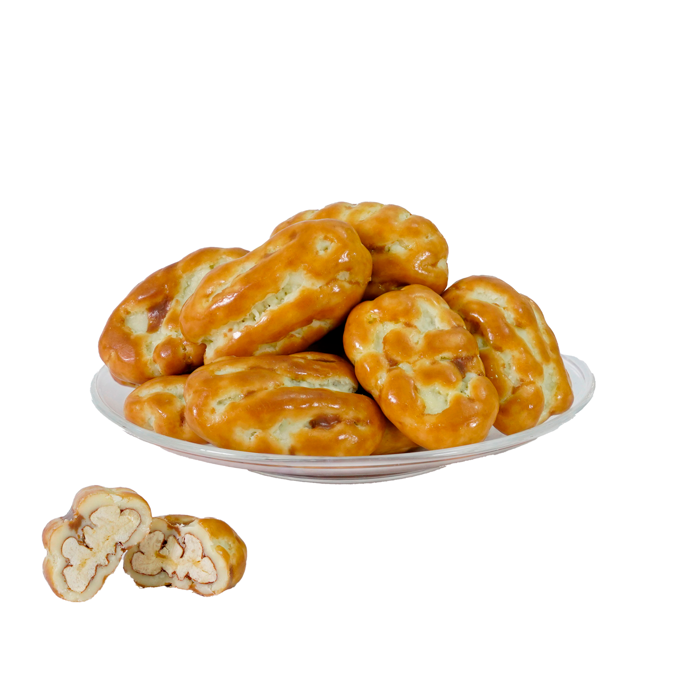 A plate of pecan caramel treats, with a focus on one treat showing the pecan nuts on the side.