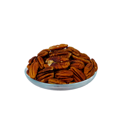 A clear glass bowl filled with premium pecans against a black background.
