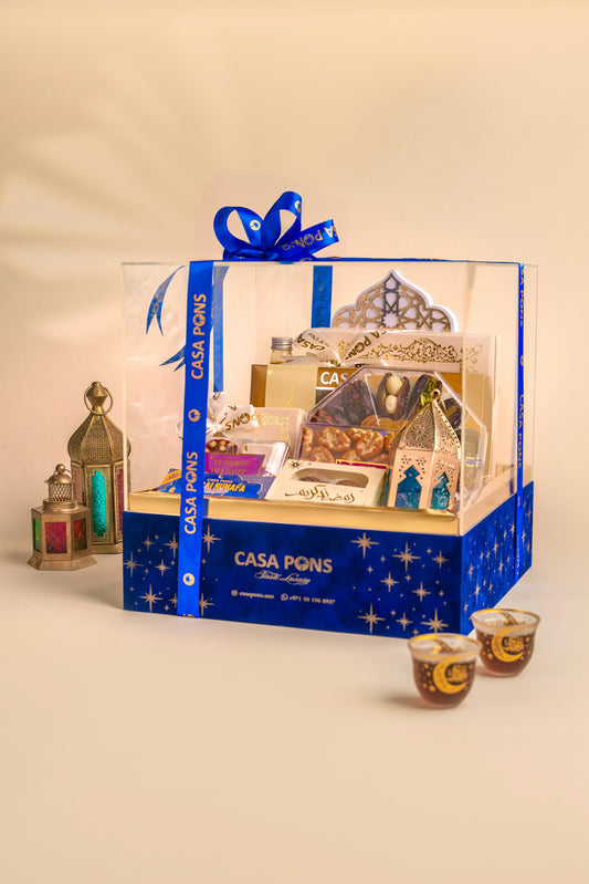Casa Pons gift set with blue ribbon on a beige background