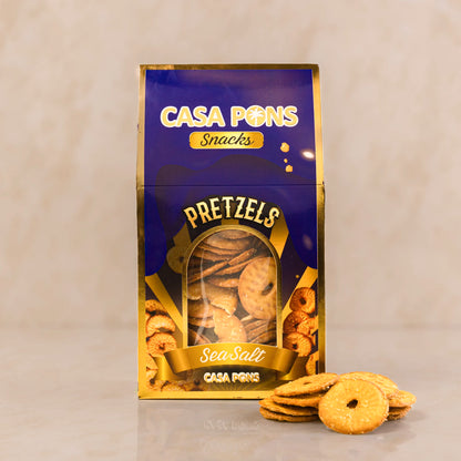 Casa Snacks Sea Salt Pretzels 120 g box in golden tones featuring oven-baked pretzels displayed beside the packaging.