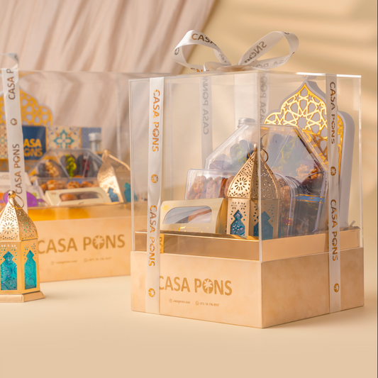 Decorative lanterns in clear packaging with 'CASA PONS' branding on a beige background