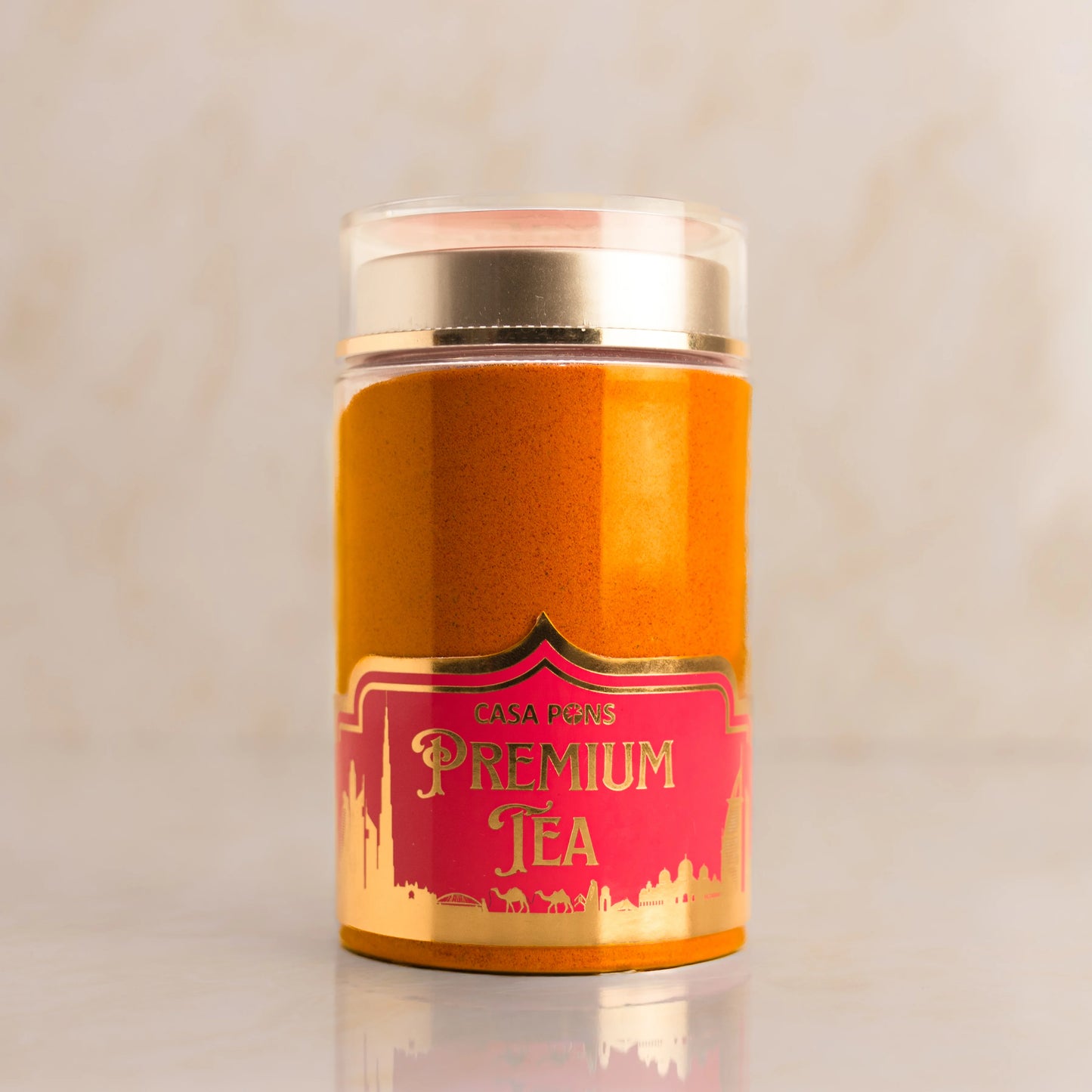 Casa Pupo Premium Tea canister with gold lid on a light beige background