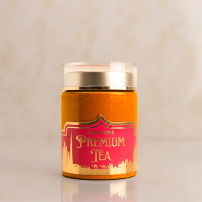 Casa Pons Premium Tea canister with gold lid on a beige background