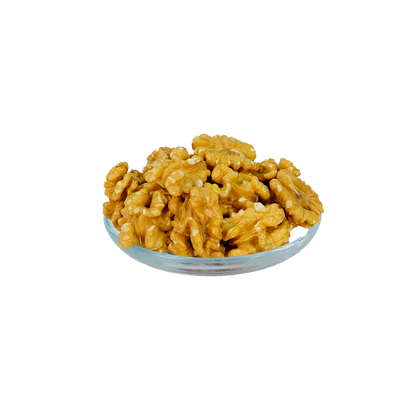 A bowl of walnut pieces on a dark background.