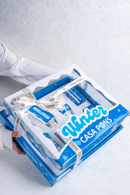 Packaging of Casa Pons winter products on a light gray background