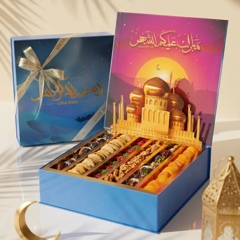 Box of assorted dried fruits with a colorful box featuring a mosque design on a white background.