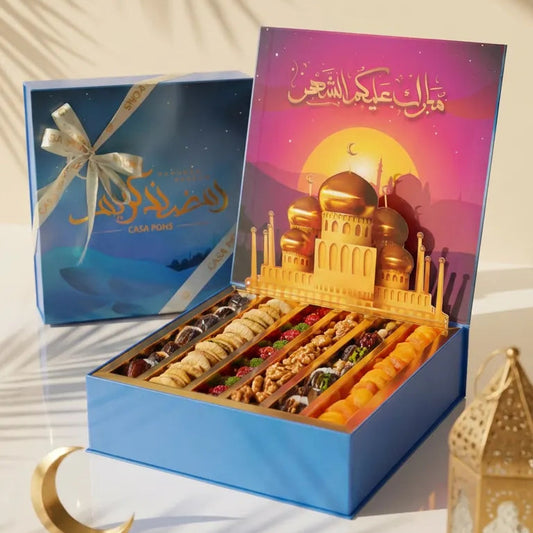 Box of assorted dried fruits with a colorful box featuring a mosque design on a white background.