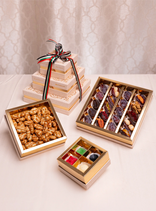 Assorted chocolate and nut gift boxes on a light background
