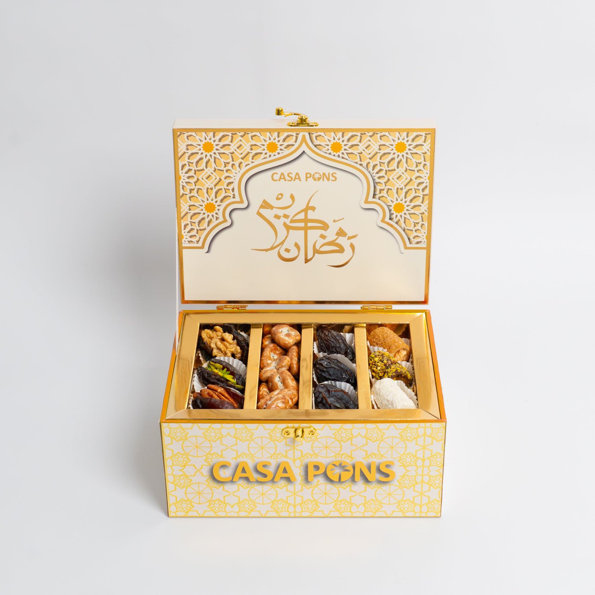 Decorative box with 'Casa Pigns' branding containing various snacks on a light gray background